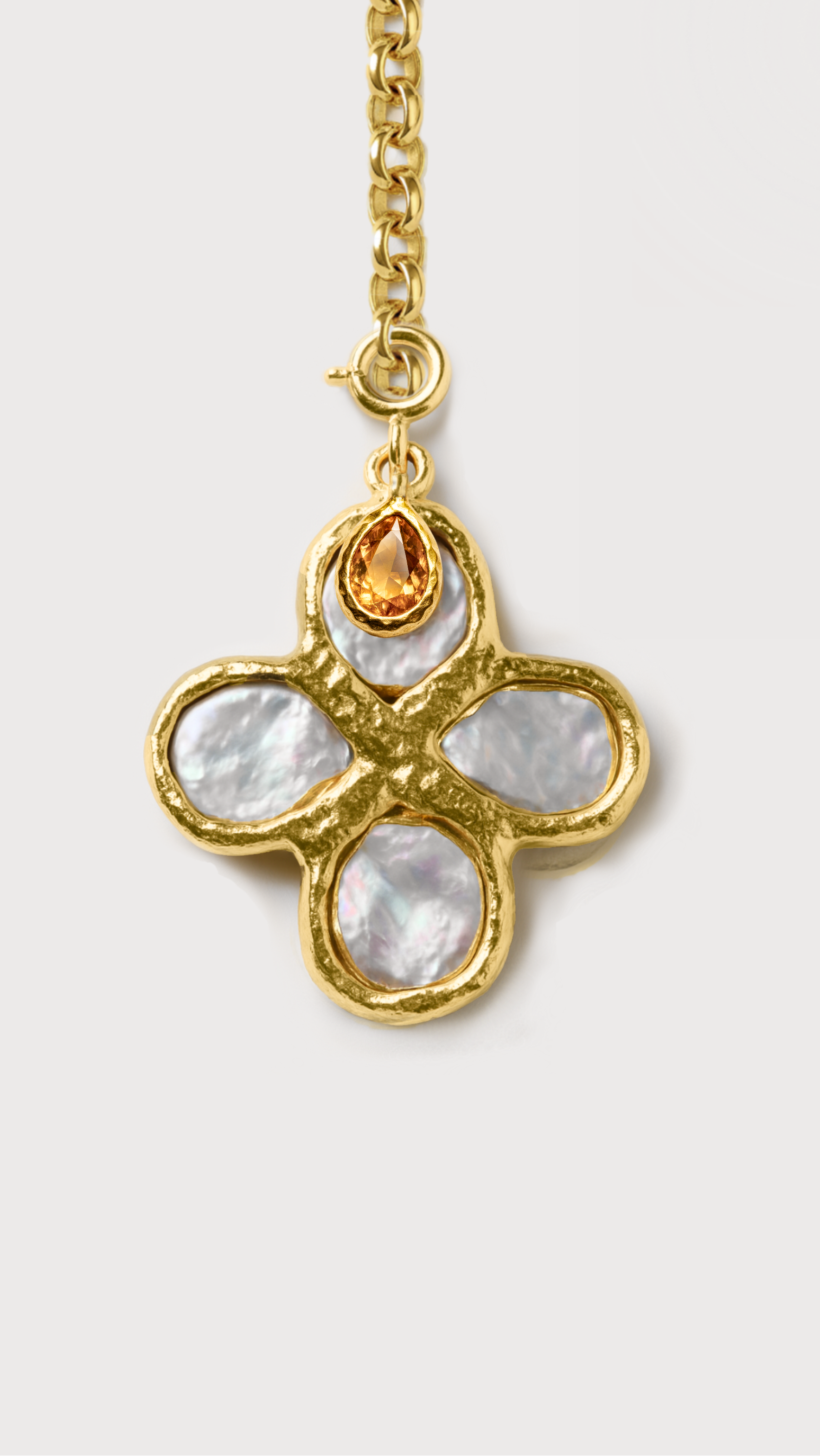 Gold necklaces with butterfly pendants on a white background