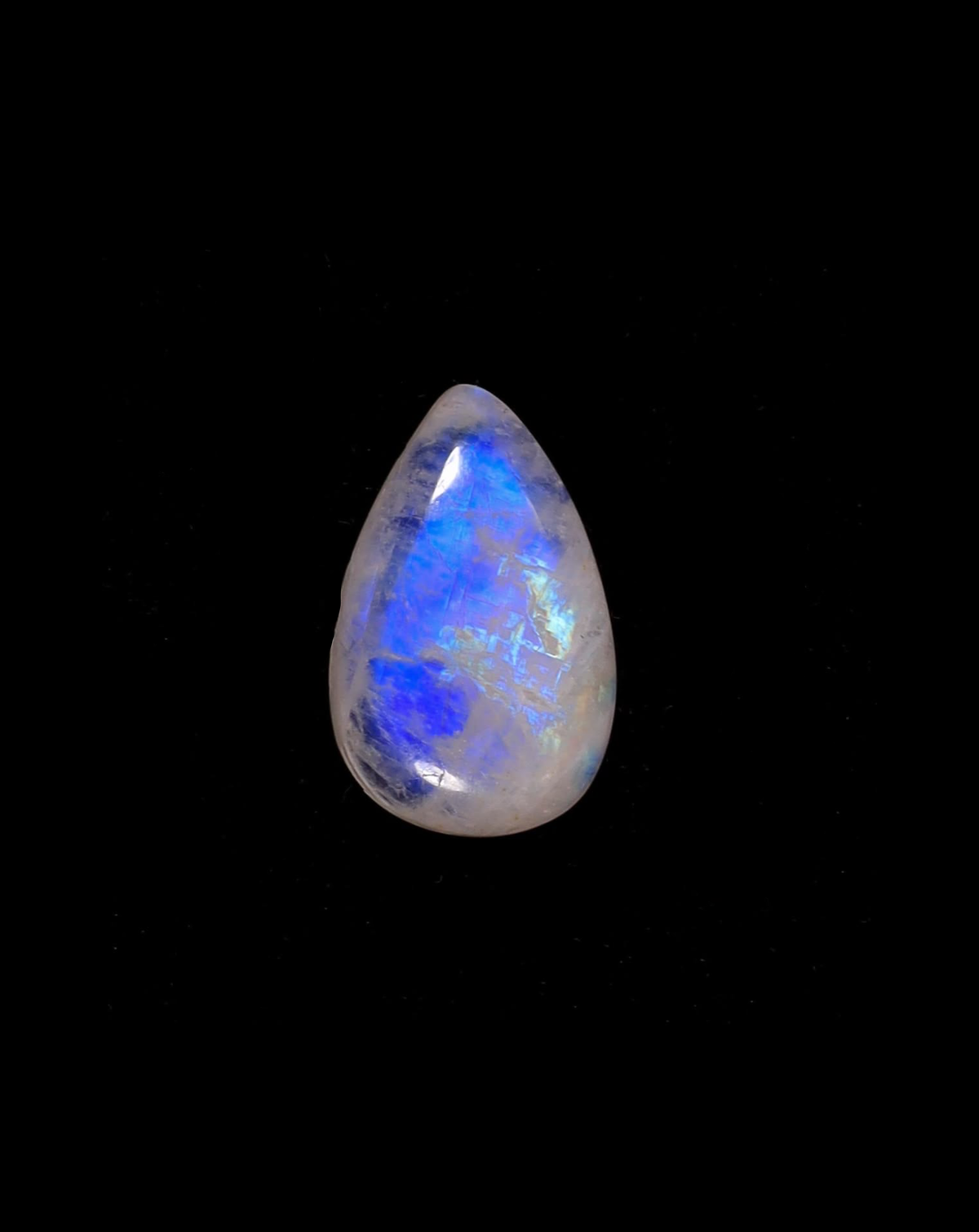 Blue-flash moonstone cabochon against black